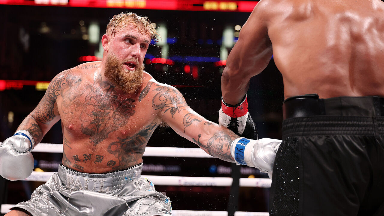 ARLINGTON, TEXAS - NOVEMBER 15: (L-R) Jake Paul and Mike Tyson fight during LIVE On Netflix: Jake Paul vs. Mike Tyson at AT&T Stadium on November 15, 2024 in Arlington, Texas.