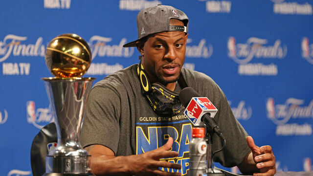 CLEVELAND, OH - JUNE 16: Andre Iguodala #9 of the Golden State Warriors with the Bill Russell NBA Finals Most Valuable Player Award at the post game press conference after Game Six of the 2015 NBA Finals against the Cleveland Cavaliers on June 16, 2015 at Quicken Loans Arena in Cleveland, Ohio. NOTE TO USER: User expressly acknowledges and agrees that, by downloading and/or using this photograph, user is consenting to the terms and conditions of the Getty Images License Agreement. Mandatory Copyright Notice: Copyright 2015 NBAE