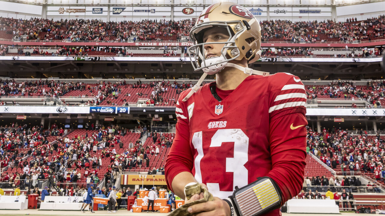 49ers quarterback Brock Purdy (13) waits on the field for players to gather for a prayer after the San Francisco 49ers played the Seattle Seahawks at Levi's Stadium in Santa Clara, Calif., on Sunday, November 17, 2024.