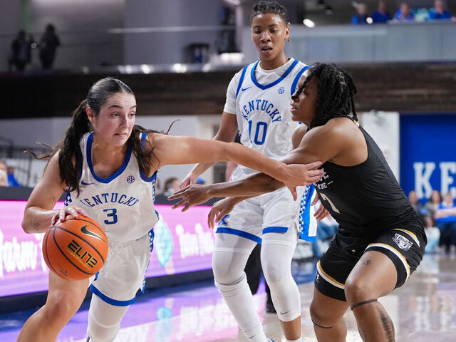 LEXINGTON, KENTUCKY - NOVEMBER 18: Georgia Amoore #3 of the Kentucky Wildcats drives against Tia Morgan #7 of the Purdue Fort Wayne Mastodons in the third quarter at the Memorial Coliseum on November 18, 2024 in Lexington, Kentucky.