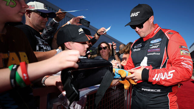 AVONDALE, ARIZONA - NOVEMBER 10: Ryan Preece, driver of the #41 HaasTooling.com Ford, signs autographs for NASCAR fans on the red carpet prior to the NASCAR Cup Series Championship Race at Phoenix Raceway on November 10, 2024 in Avondale, Arizona.