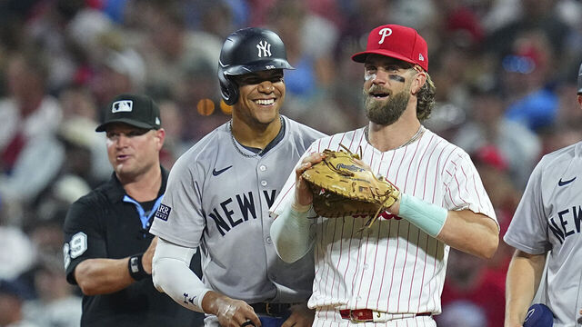 PHILADELPHIA, PENNSYLVANIA - JULY 29: Juan Soto #22 of the New York Yankees interacts with Bryce Harper #3 of the Philadelphia Phillies at Citizens Bank Park on July 29, 2024 in Philadelphia, Pennsylvania. The Yankees defeated the Phillies 14-4.