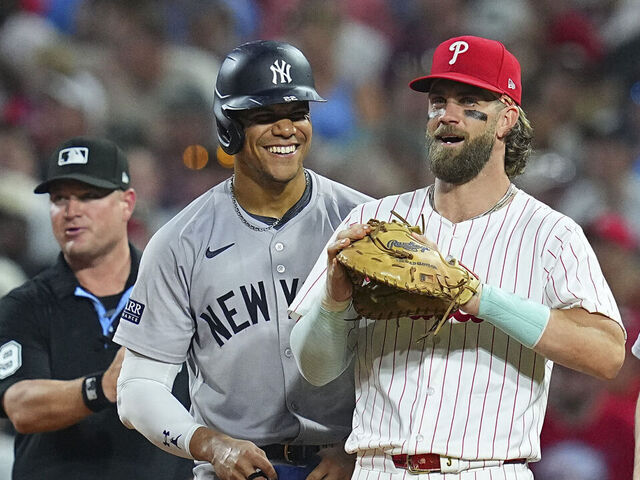 PHILADELPHIA, PENNSYLVANIA - JULY 29: Juan Soto #22 of the New York Yankees interacts with Bryce Harper #3 of the Philadelphia Phillies at Citizens Bank Park on July 29, 2024 in Philadelphia, Pennsylvania. The Yankees defeated the Phillies 14-4.