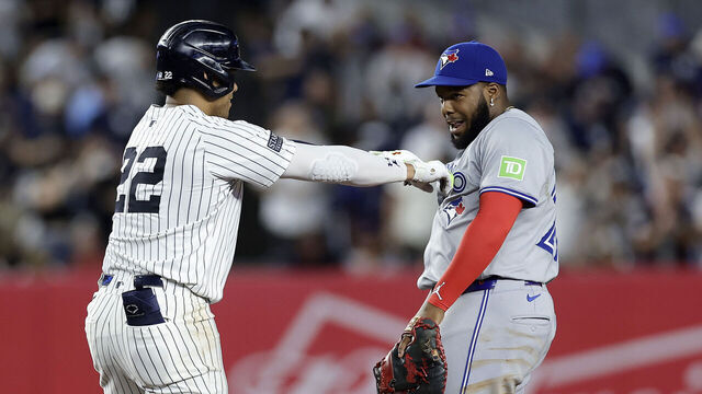 NEW YORK, NEW YORK - AUGUST 02: Juan Soto #22 of the New York Yankees jokes with Vladimir Guerrero Jr. #27 of the Toronto Blue Jays at second base after his double during the first inning at Yankee Stadium on August 02, 2024 in New York City.