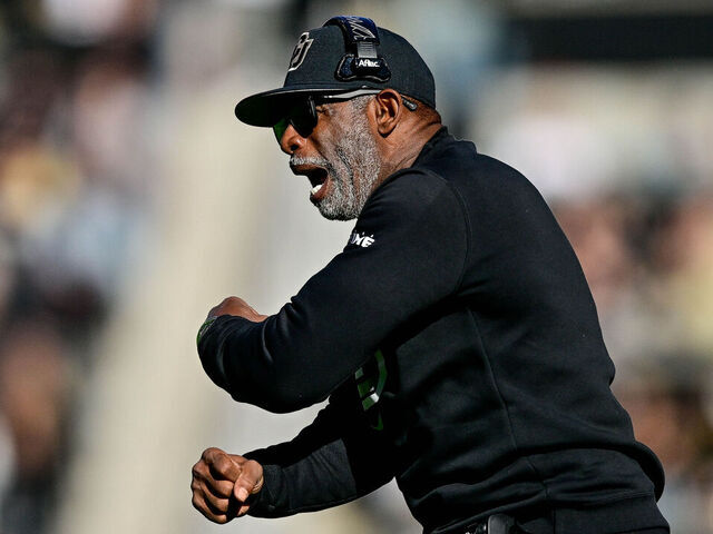 BOULDER, CO - NOVEMBER 16: Head coach Deion Sanders of the Colorado Buffaloes directs his team in the first half of a game against the Utah Utes at Folsom Field on November 16, 2024 in Boulder, Colorado.