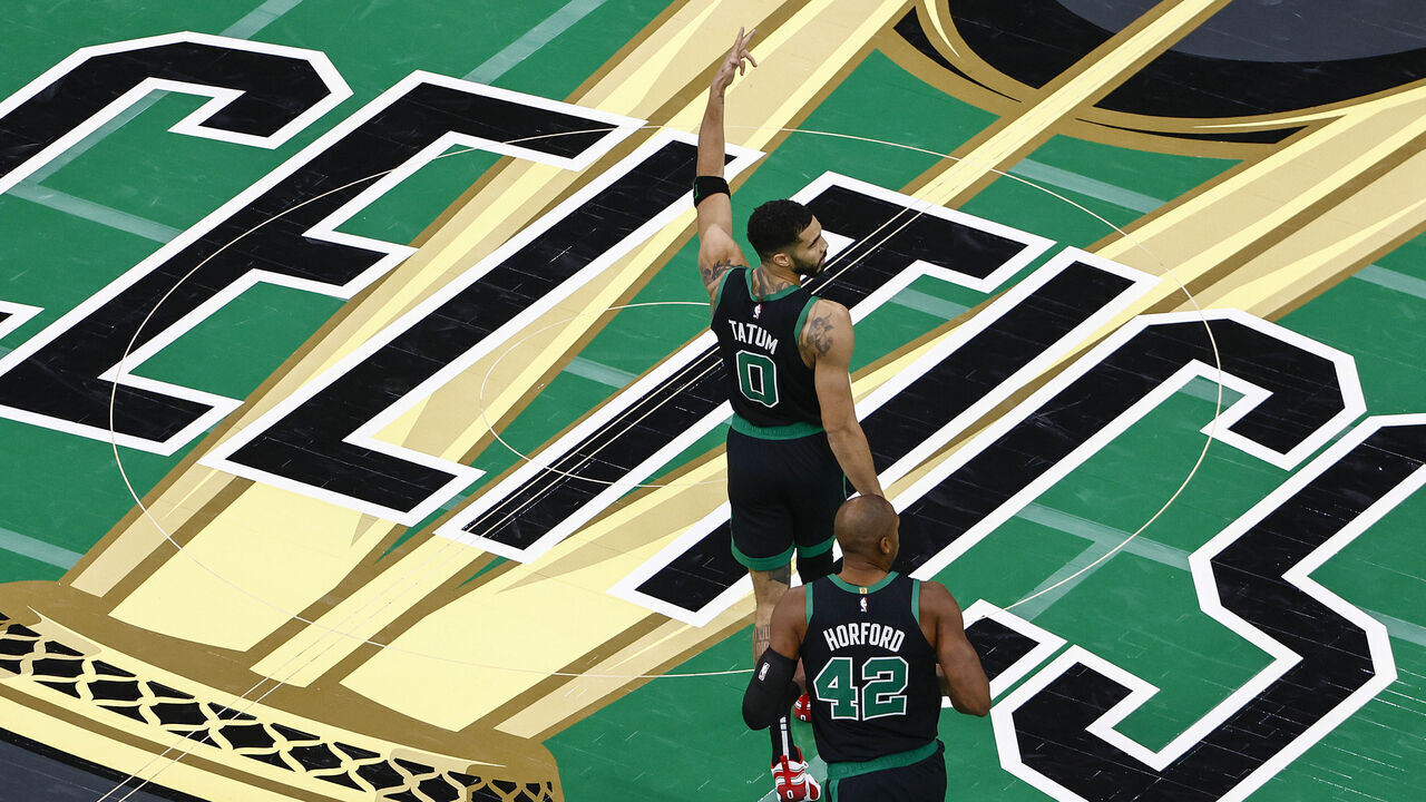 BOSTON, MASSACHUSETTS - NOVEMBER 19: Jayson Tatum #0 of the Boston Celtics reacts to a basket alongside teammate Al Horford #42 against the Cleveland Cavaliers during the second quarter of the Emirates NBA Cup at TD Garden on November 19, 2024 in Boston, Massachusetts.