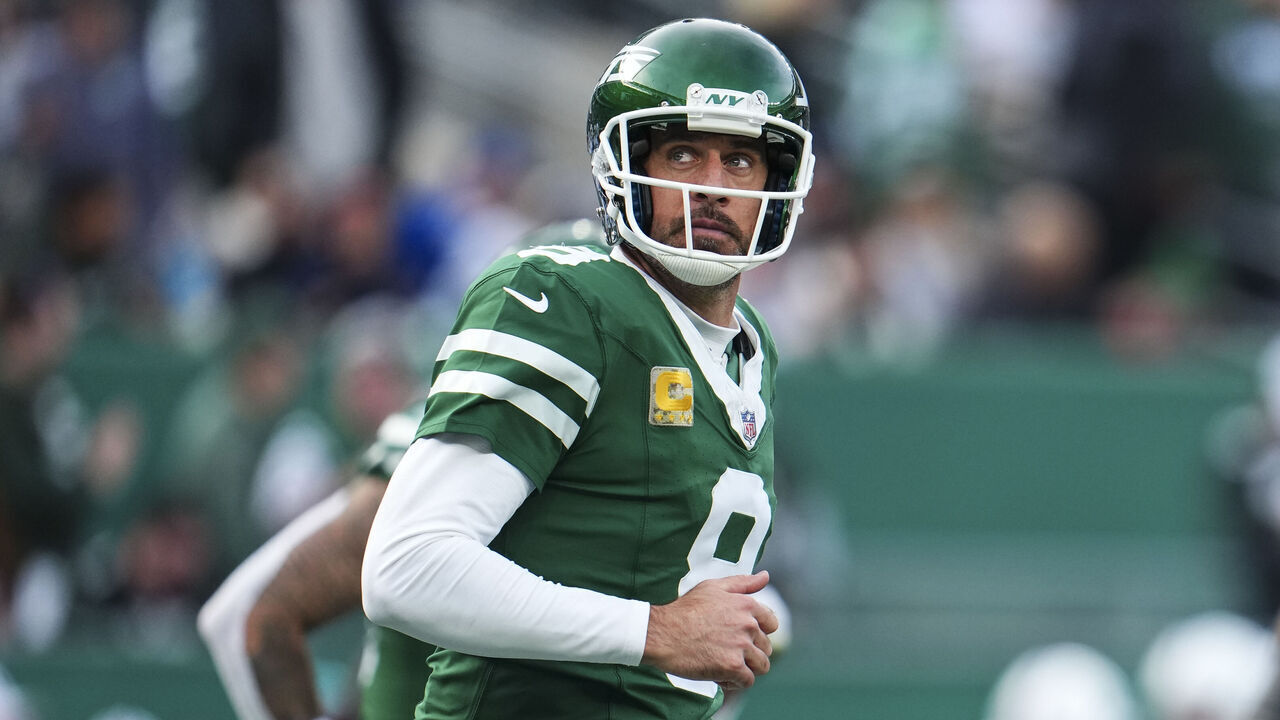 EAST RUTHERFORD, NJ - NOVEMBER 17: Aaron Rodgers #8 of the New York Jets looks on from the field during an NFL football game against the Indianapolis Colts at MetLife Stadium on November 17, 2024 in East Rutherford, New Jersey.