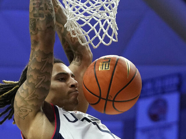 STORRS, CONNECTICUT - NOVEMBER 19: Solo Ball #1 of the Connecticut Huskies dunks during the first half of an NCAA basketball game at the Harry A. Gampel Pavilion on November 19, 2024 in Storrs, Connecticut. The Huskies defeated the Lions 81-46.