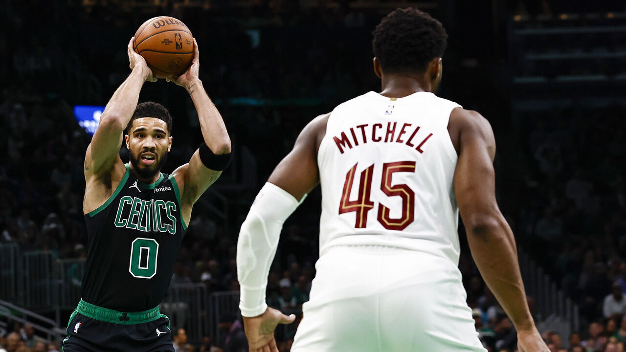 BOSTON, MASSACHUSETTS - NOVEMBER 19: Jayson Tatum #0 of the Boston Celtics looks to pass against Donovan Mitchell #45 of the Cleveland Cavaliers during the first quarter of the Emirates NBA Cup at TD Garden on November 19, 2024 in Boston, Massachusetts.