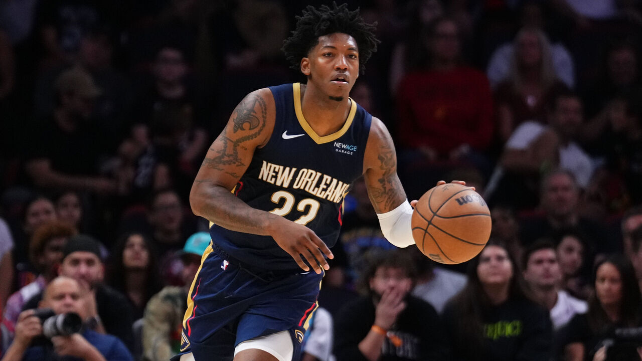 MIAMI, FLORIDA - OCTOBER 13: Elfrid Payton #22 of the New Orleans Pelicans dribbles the ball against the Miami Heat during a preseason game at Kaseya Center on October 13, 2024 in Miami, Florida.
