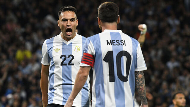 Lautaro Martinez and Lionel Messi of Argentina celebrate their team's goal during the match between Argentina and Peru at Alberto J. Armando - La Bombonera Stadium, in Buenos Aires, Argentina, on November 19.
