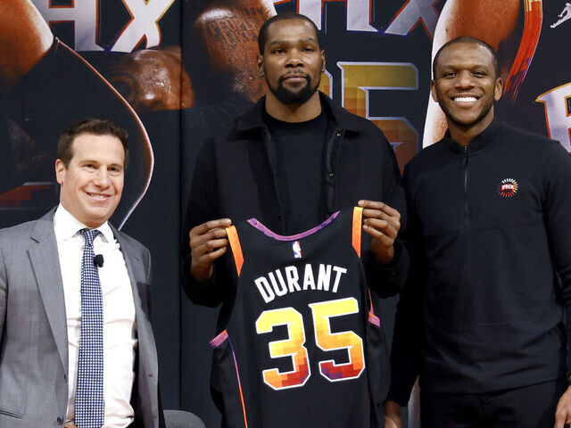 PHOENIX, ARIZONA - FEBRUARY 16: (L-R) Owner Mat Ishbia, Kevin Durant and general manager James Jones of the Phoenix Suns pose for a photo at a press conference at Footprint Center on February 16, 2023 in Phoenix, Arizona. NOTE TO USER: User expressly acknowledges and agrees that, by downloading and/or using this photograph, User is consenting to the terms and conditions of the Getty Images License Agreement.