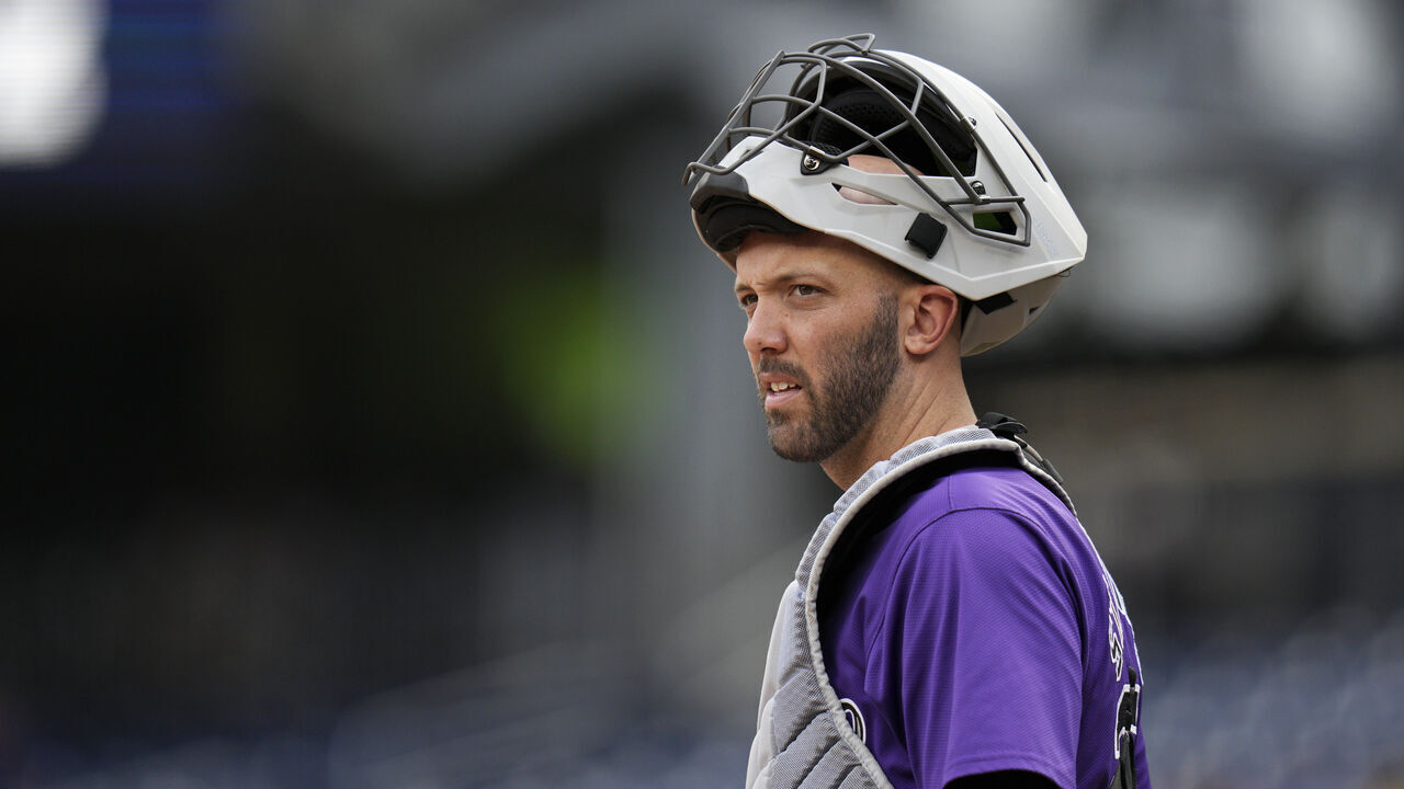 WASHINGTON, DC - AUGUST 22: Jacob Stallings #25 of the Colorado Rockies looks to the dugout during the first inning against the Washington Nationals at Nationals Park on August 22, 2024 in Washington, DC.