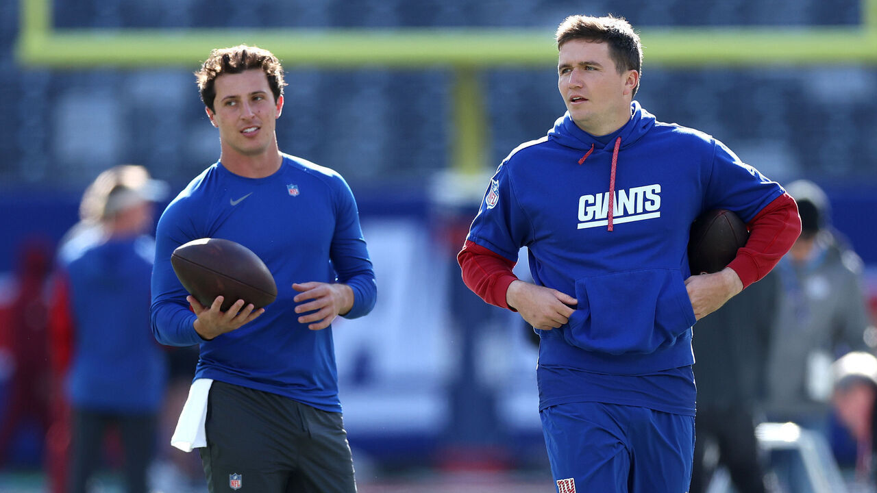 EAST RUTHERFORD, NEW JERSEY - NOVEMBER 03: Tommy DeVito #15 and Drew Lock #2 of the New York Giants warm up before the game against the Washington Commanders at MetLife Stadium on November 03, 2024 in East Rutherford, New Jersey.