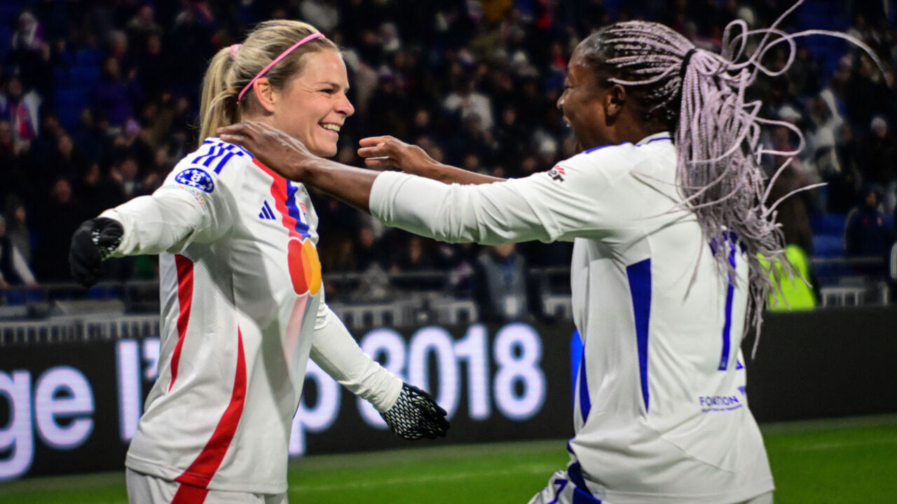 Lyon's French forward #09 Eugenie Le Sommer (L) celebrates scoring her team's third goal with Lyon's French forward #11 Kadidiatou Diani during the UEFA Women's Champions League Group A football match between Olympique Lyonnais (OL) and AS Roma at the Parc Olympique Lyonnais in Decines-Charpieu, central-eastern France on November 20, 2024.