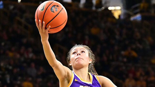 IOWA CITY, IA - DECEMBER 18: UNI guard Maya McDermott (0) lays up a shot during a women's college basketball game between the Northern Iowa Panthers and the Iowa Hawkeyes on December 18, 2022, at Carver-Hawkeye Arena in Iowa City, IA.