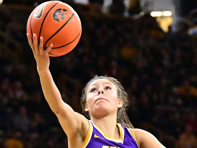 IOWA CITY, IA - DECEMBER 18: UNI guard Maya McDermott (0) lays up a shot during a women's college basketball game between the Northern Iowa Panthers and the Iowa Hawkeyes on December 18, 2022, at Carver-Hawkeye Arena in Iowa City, IA.