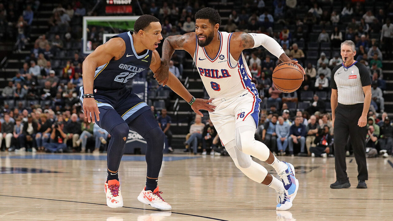 MEMPHIS, TENNESSEE - NOVEMBER 20: Paul George #8 of the Philadelphia 76ers drives to the basket against Desmond Bane #22 of the Memphis Grizzlies during the first half at FedExForum on November 20, 2024 in Memphis, Tennessee.