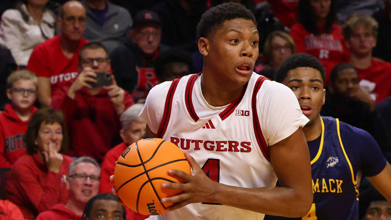 PISCATAWAY, NEW JERSEY - NOVEMBER 20: Ace Bailey #4 of the Rutgers Scarlet Knights dribbles the ball while being defended by Tye Dorset #4 of the Merrimack Warriors during the second half at Jersey Mike's Arena on November 20, 2024 in Piscataway, New Jersey.