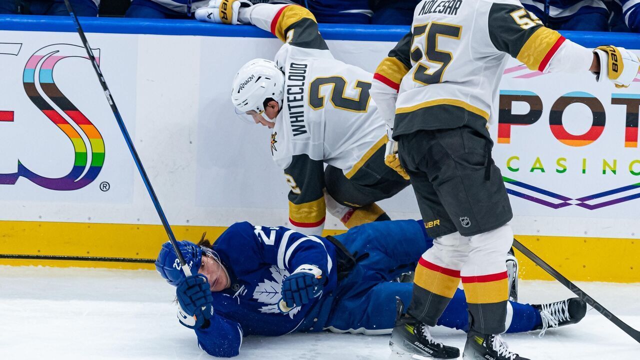 TORONTO, ON - NOVEMBER 20: Vegas Golden Knights Defenceman Zach Whitecloud (2) checks Toronto Maple Leafs Left Wing Matthew Knies (23) during the second period of the NHL regular season game between the Vegas Golden Knights and the Toronto Maple Leafs on November 20, 2024, at Scotiabank Arena in Toronto, ON, Canada.