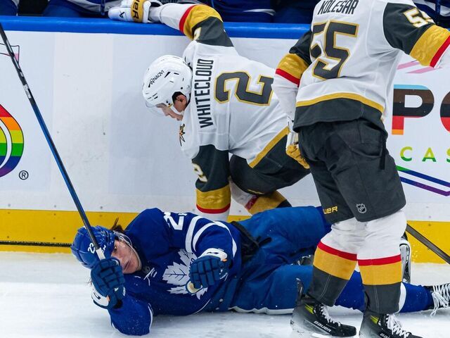 TORONTO, ON - NOVEMBER 20: Vegas Golden Knights Defenceman Zach Whitecloud (2) checks Toronto Maple Leafs Left Wing Matthew Knies (23) during the second period of the NHL regular season game between the Vegas Golden Knights and the Toronto Maple Leafs on November 20, 2024, at Scotiabank Arena in Toronto, ON, Canada.