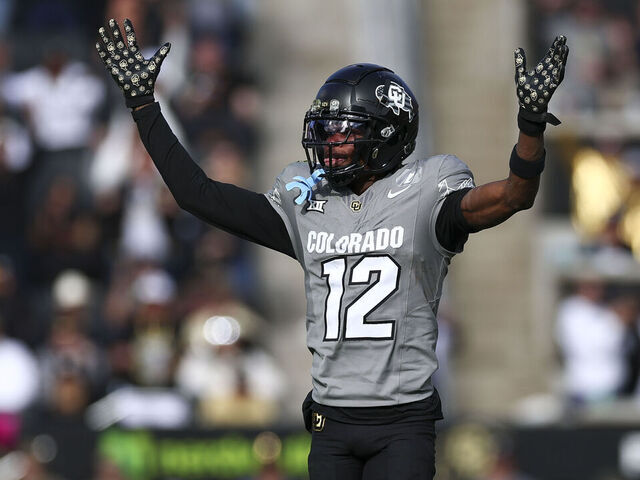 BOULDER, COLORADO - NOVEMBER 16: Travis Hunter #12 of the Colorado Buffaloes celebrates during the second half against the Utah Utes at Folsom Field on November 16, 2024 in Boulder, Colorado.