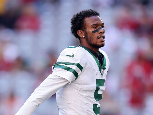 GLENDALE, ARIZONA - NOVEMBER 10: Garrett Wilson #5 of the New York Jets walks across the field before the game against the Arizona Cardinals at State Farm Stadium on November 10, 2024 in Glendale, Arizona.