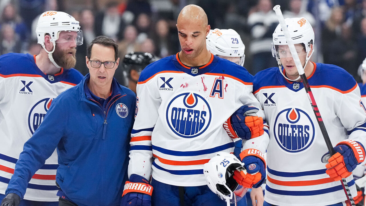 TORONTO, CANADA - NOVEMBER 16: Darnell Nurse #25 of the Edmonton Oilers is helped off the ice following a hit from Ryan Reaves #75 of the Toronto Maple Leafs at Scotiabank Arena on November 16, 2024 in Toronto, Ontario, Canada.