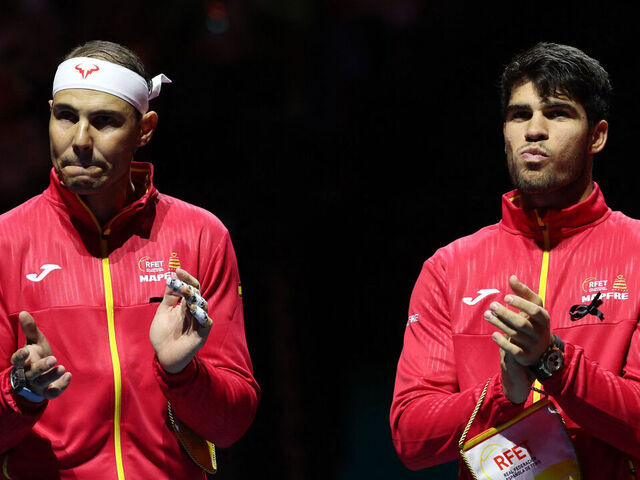 Spain's Rafael Nadal (L) applauds next to Spain's Carlos Alcaraz prior the quarter-final singles match between Netherlands and Spain during the Davis Cup Finals at the Palacio de Deportes Jose Maria Martin Carpena arena in Malaga, southern Spain, on November 19, 2024. The Davis Cup will be the final professional tournament of Nadal's glittering career of almost 23 years.