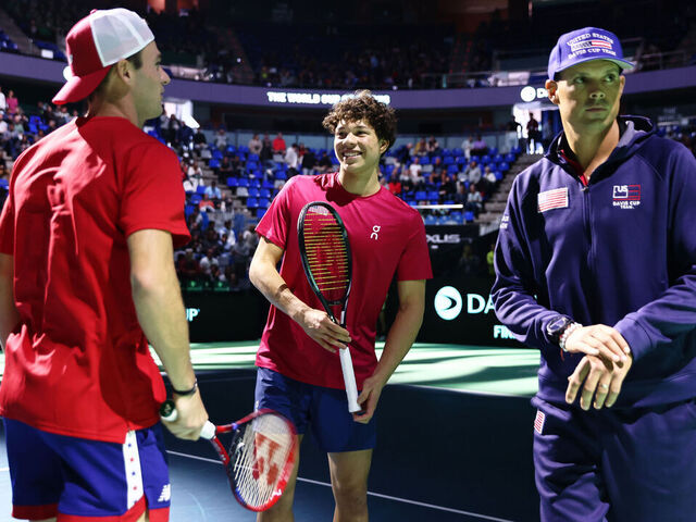 MALAGA, SPAIN - NOVEMBER 21: Ben Shelton of Team USA prepares on court with Tommy Paul and Bob Bryan during the Davis Cup Quarter Final match betwen USA and Australia at Palacio de Deportes Jose Maria Martin Carpena on November 21, 2024 in Malaga, Spain.