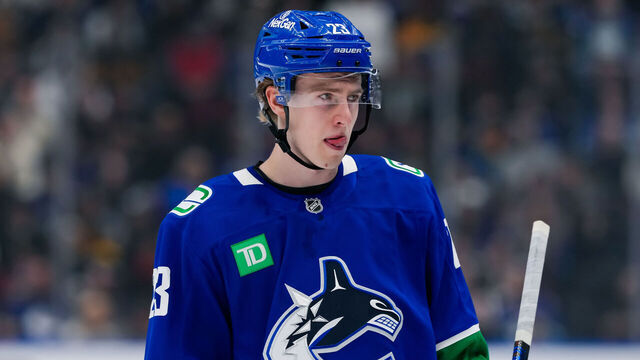 VANCOUVER, CANADA - NOVEMBER 14: Jonathan Lekkerimaki #23 of the Vancouver Canucks looks on during the first period of their NHL game against the New York Islanders at Rogers Arena on November 14, 2024 in Vancouver, British Columbia, Canada.