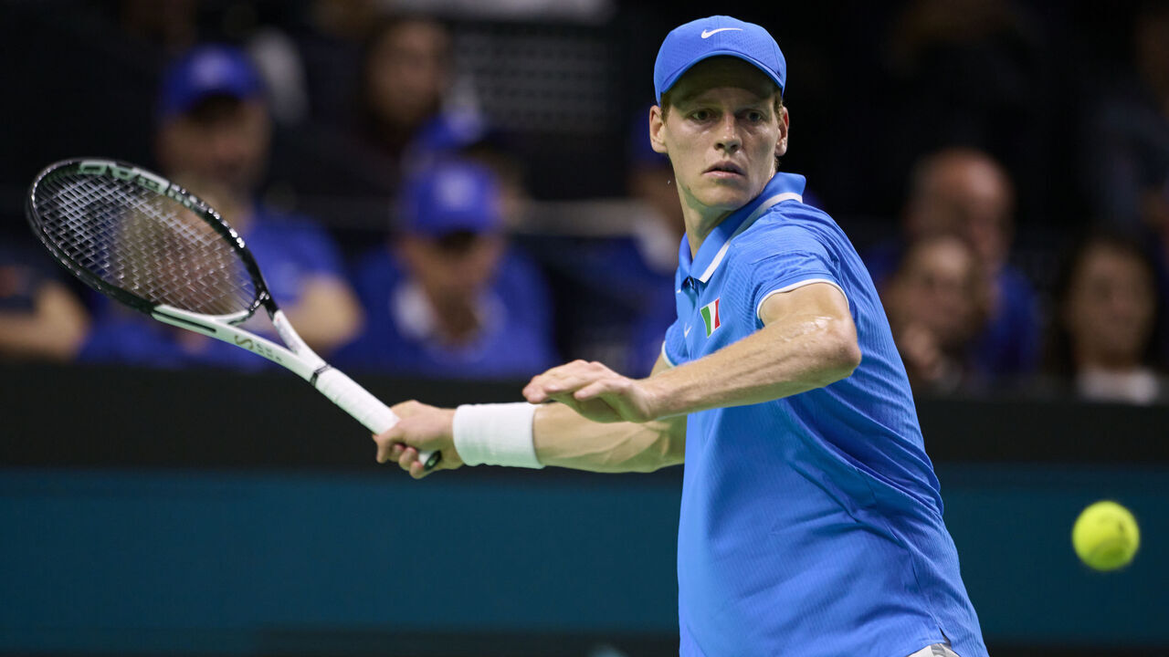 MALAGA, SPAIN - NOVEMBER 21: Jannik Sinner of team Italy look to returns a ball in his match against Sebastian Baez of Team Argentina in the quarterfinal tie between Italy and Argentina during the Davis Cup Finals at Palacio de Deportes Jose Maria Martin Carpena on November 21, 2024 in Malaga, Spain.