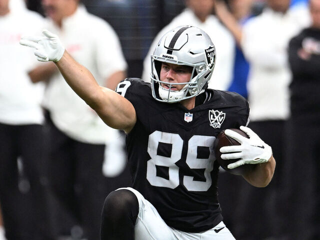 LAS VEGAS, NEVADA - OCTOBER 27: Brock Bowers #89 of the Las Vegas Raiders signals for a first down after a making a catch against Nazeeh Johnson #13 of the Kansas City Chiefs in the second quarter of a game at Allegiant Stadium on October 27, 2024 in Las Vegas, Nevada.