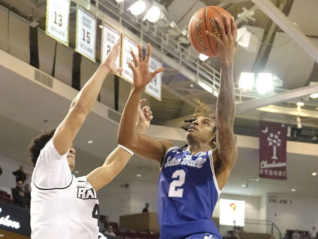 CHARLESTON, SC - NOVEMBER 21: Chaunce Jenkins #2 of the Seton Hall Pirates drives to the basket past Jack Clark #4 of the Virginia Commonwealth Rams in the second half during the Shriners Children's Charleston Classic college basketball game at TD Arena on November 21, 2024 in Charleston, South Carolina.