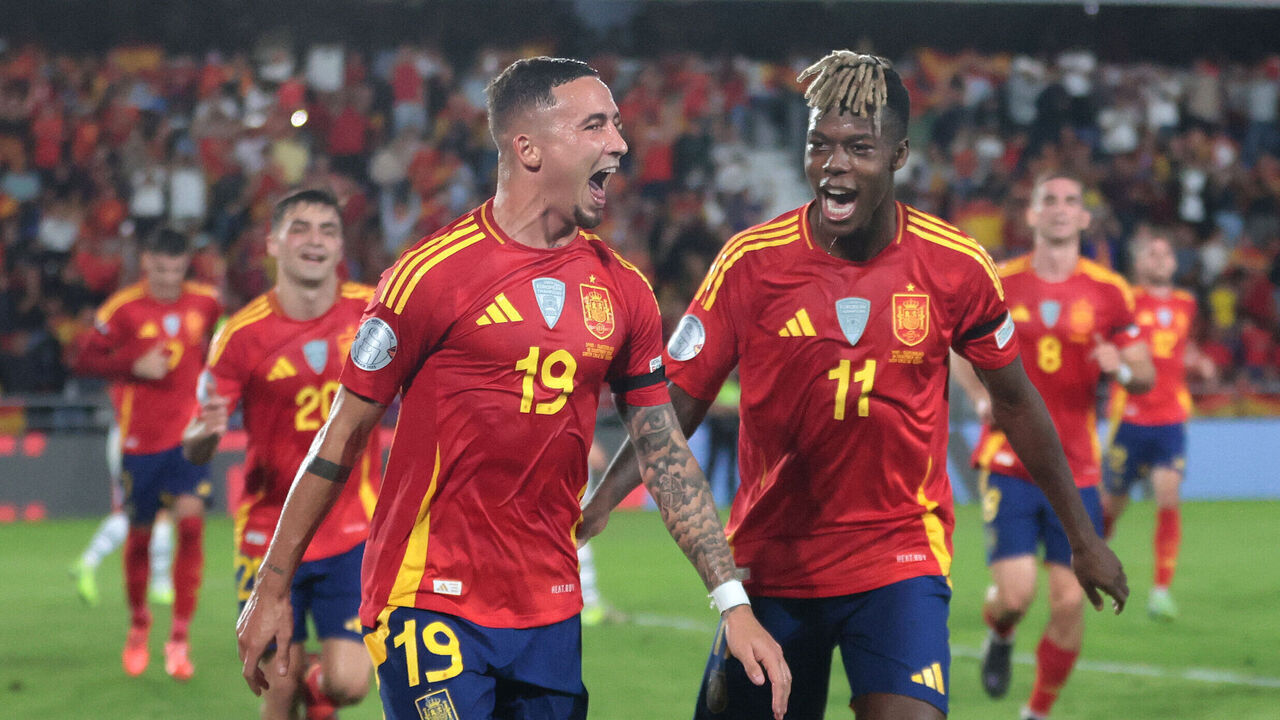 Spain's forward #19 Yeremi Pino celebrates with Spain's midfielder #11 Nico Williams scoring his team's first goal during the UEFA Nations League, League A Group A4, football match between Spain and Switzerland at the Heliodoro Rodriguez Lopez stadium in Tenerife, in Spain's Canary Islands, on November 18 2024.