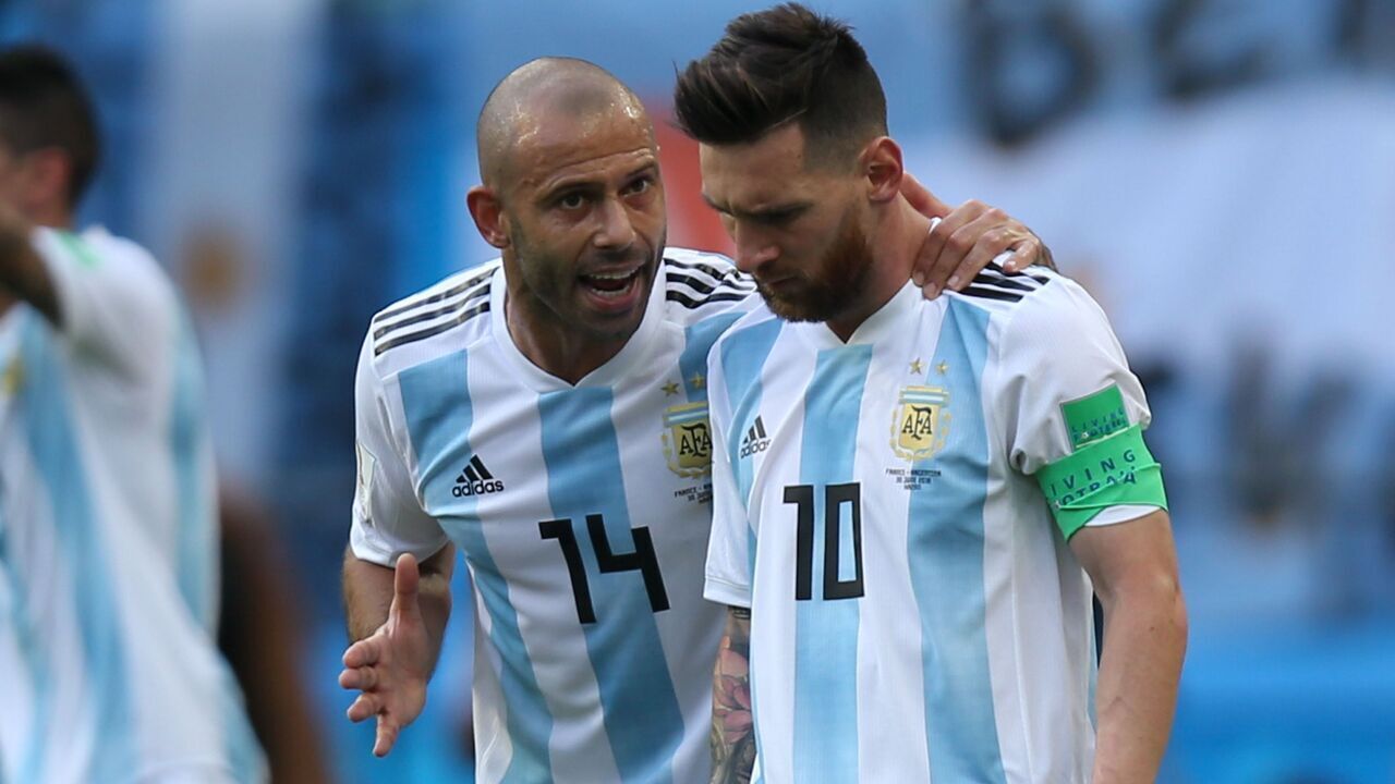 Argentina's forward Lionel Messi (R) and Argentina's midfielder Javier Mascherano react after their first goal during the Russia 2018 World Cup round of 16 football match between France and Argentina at the Kazan Arena in Kazan on June 30, 2018.