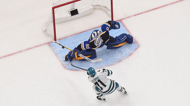 ST. LOUIS, MO - NOVEMBER 21: Jordan Binnington #50 of the St. Louis Blues blocks a shot from Macklin Celebrini #71 of the San Jose Sharks in a shoot out on November 21, 2024 at the Enterprise Center in St. Louis, Missouri.