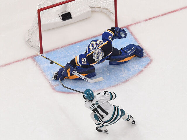ST. LOUIS, MO - NOVEMBER 21: Jordan Binnington #50 of the St. Louis Blues blocks a shot from Macklin Celebrini #71 of the San Jose Sharks in a shoot out on November 21, 2024 at the Enterprise Center in St. Louis, Missouri.