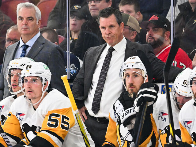 MONTREAL, CANADA - OCTOBER 14: Assistant coach Mike Vellucci and head coach Mike Sullivan of the Pittsburgh Penguins handle bench duties during the second period against the Montreal Canadiens at the Bell Centre on October 14, 2024 in Montreal, Quebec, Canada. The Pittsburgh Penguins defeated the Montreal Canadiens 6-3.