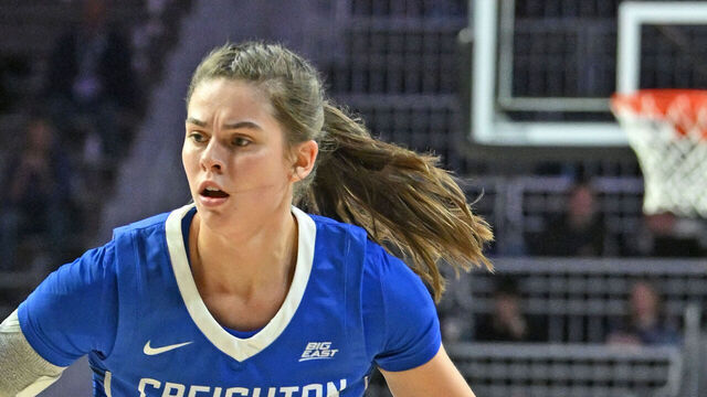 MANHATTAN, KS - NOVEMBER 14: Lauren Jensen #15 of the Creighton Bluejays dribbles against Zyanna Walker #1 of the Kansas State Wildcats in the second half at Bramlage Coliseum on November 14, 2024 in Manhattan, Kansas.