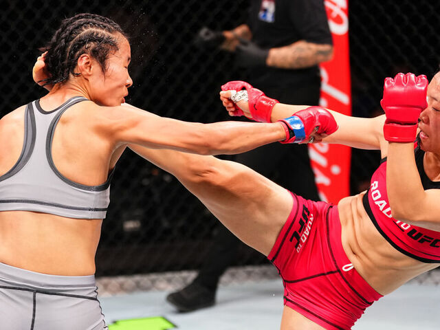MACAU, CHINA - NOVEMBER 23: (R-L) Shi Ming of China kicks Feng Xiaocan of China in their Women’s Strawweight RTU Tournament Final fight during the UFC Fight Night event at Galaxy Arena on November 23, 2024 in Macau, China.