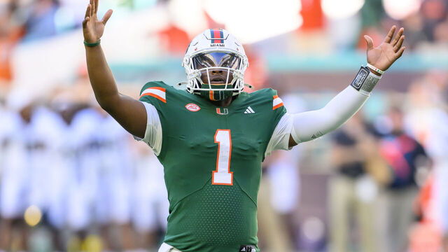 MIAMI GARDENS, FL - NOVEMBER 23: Miami Quarterback Cam Ward (1) raises his arms as he celebrates running back Jordan Lyle (not shown) scoring a touchdown during the college football game between the Wake Forest Deacon Demons and the University of Miami Hurricanes on November 23, 2024 at the Hard Rock Stadium in Miami Gardens, FL.