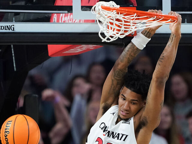 CINCINNATI, OHIO - NOVEMBER 15: Dillon Mitchell #23 of the Cincinnati Bearcats dunks the ball in the second half against the Nicholls Colonels at Fifth Third Arena on November 15, 2024 in Cincinnati, Ohio.