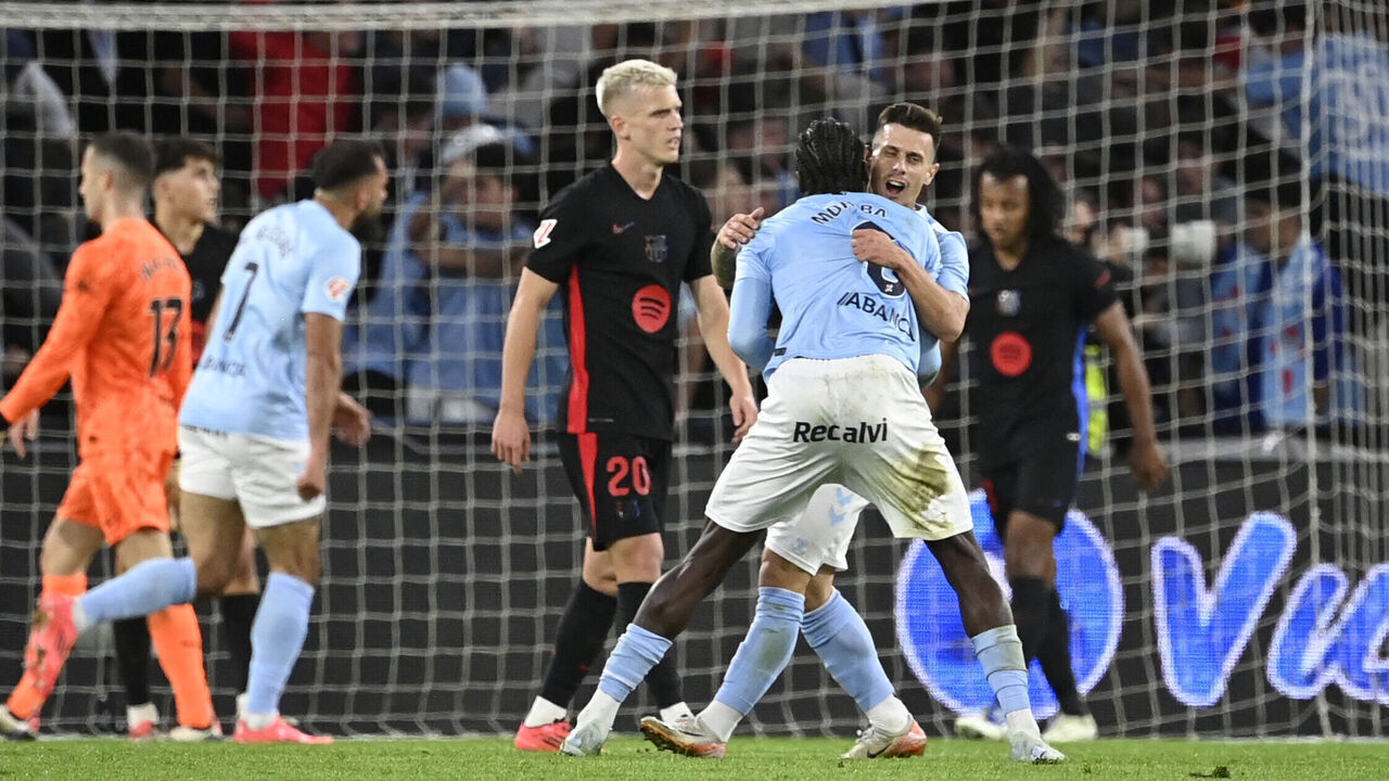 Celta Vigo's players celebrate their team's second goal during the Spanish league football match between RC Celta de Vigo and FC Barcelona at the Balaidos stadium in Vigo on November 23, 2024.