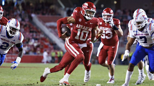 FAYETTEVILLE ), ARKANSAS - NOVEMBER 23: Taylen Green #10 of the Arkansas Razorbacks runs the ball in for a touchdown in the second half of a game against the Louisiana Tech Bulldogs at Donald W. Reynolds Razorback Stadium on November 23, 2024 in Fayetteville, Arkansas. The Razorbacks defeated the Bulldogs 35-14.