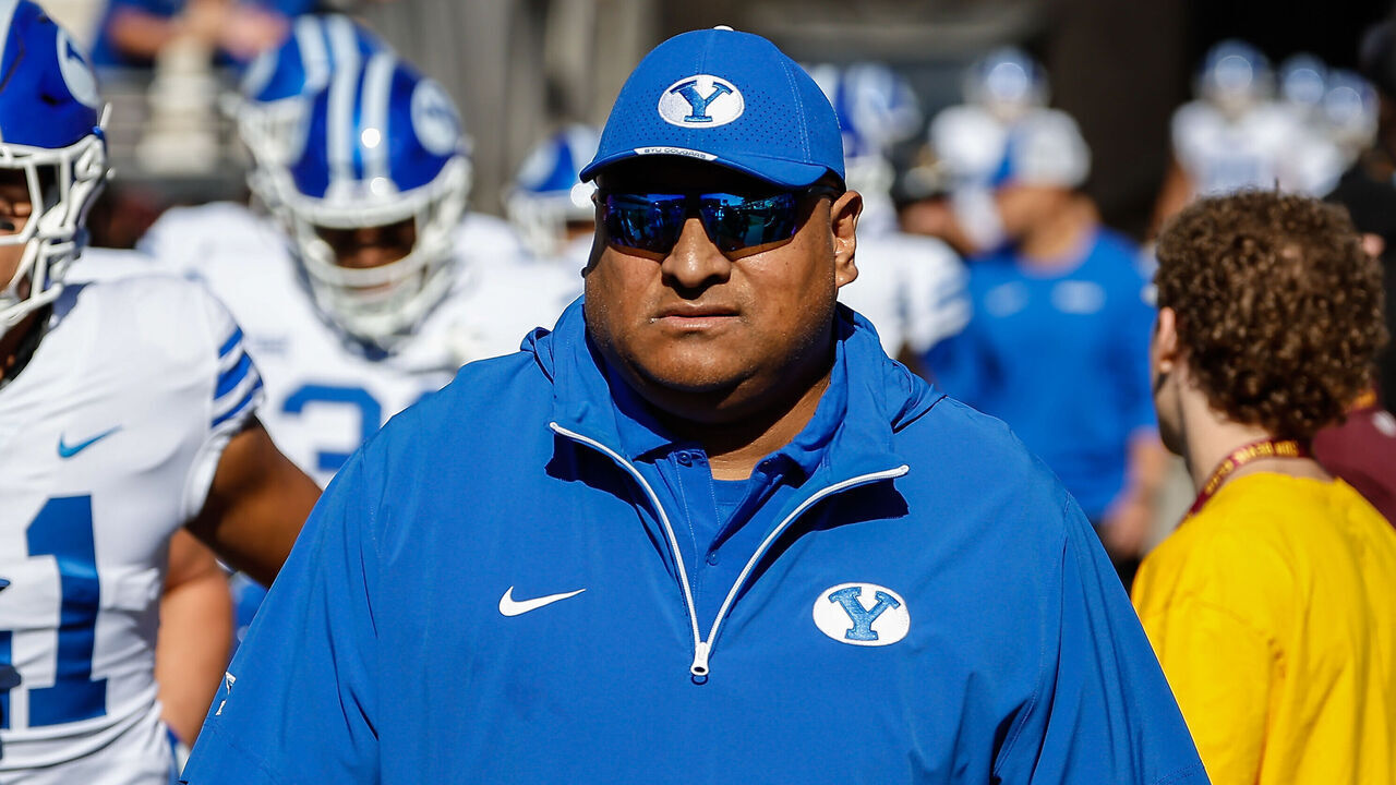 TEMPE, AZ - NOVEMBER 23: Brigham Young Cougars head coach Kalani Sitake looks on before the college football game between the BYU Cougars and the Arizona State Sun Devils on November 23, 2024 at Mountain America Stadium in Tempe, Arizona.