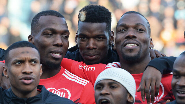 The Pogba brothers, Manchester United and France midfielder Paul Pogba (C), Atlanta United defender Florentin Pogba (L) and CD Manchego midfielder Mathias Pogba (R), pose prior to a gala football match between All Star France and Guinea at the Vallee du Cher Stadium in Tours, central France, on December 29, 2019, as part of the "48h for Guinea" charity event.