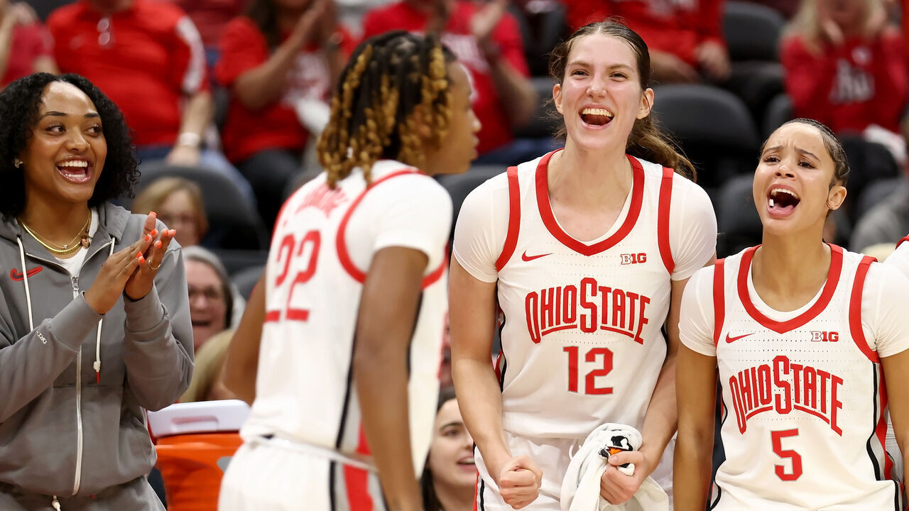 COLUMBUS, OHIO - NOVEMBER 5: Elsa Lemmil #12 of the Ohio State Buckeyes and Ava Watson #5 cheer on Jaloni Cambridge #22 during the fourth quarter of the game against the Cleveland State Vikings at Value City Arena on November 5, 2024 in Columbus, Ohio. Ohio State defeated Cleveland State 104-69.