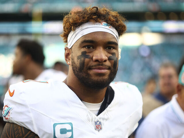 MIAMI GARDENS, FLORIDA - NOVEMBER 24: Tua Tagovailoa #1 of the Miami Dolphins walks off the field after an NFL football game against the New England Patriots at Hard Rock Stadium on November 24, 2024 in Miami Gardens, Florida.