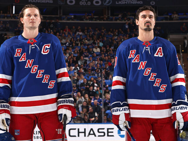 NEW YORK, NEW YORK - OCTOBER 11: Jacob Trouba #8 and Chris Kreider #20 of the New York Rangers look on during the national anthem prior to the home opener against the Tampa Bay Lightning at Madison Square Garden on October 11, 2022 in New York City.